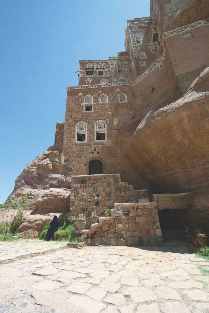 Tower home carved into rock, Yemen